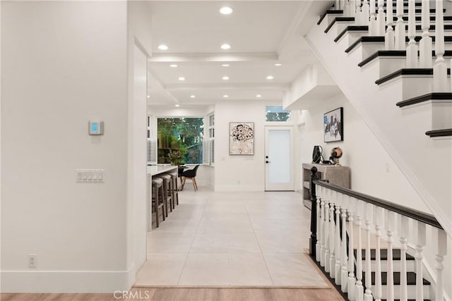 hall with light tile patterned floors