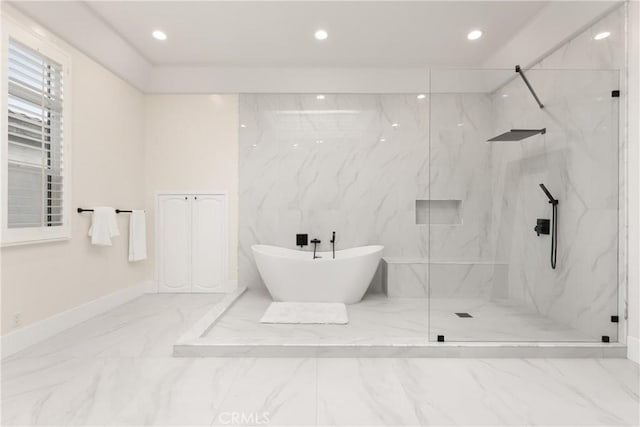 bathroom featuring separate shower and tub