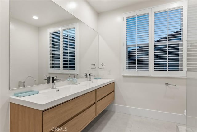 bathroom with tile patterned floors and vanity