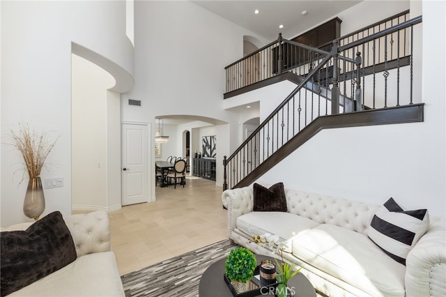 living room with a high ceiling