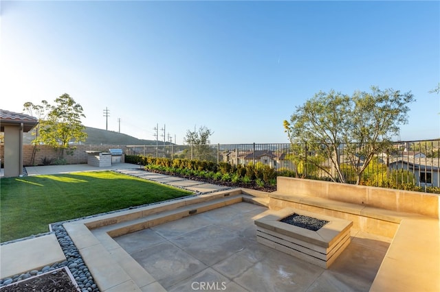 view of patio / terrace featuring a fire pit