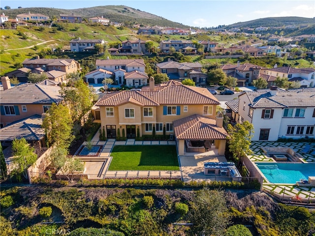 birds eye view of property with a mountain view