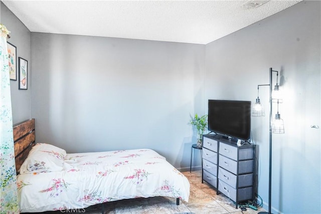 bedroom featuring light tile patterned flooring