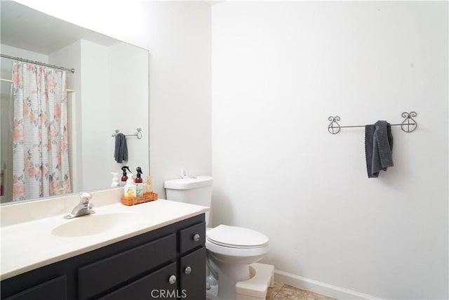 bathroom featuring tile patterned flooring, vanity, curtained shower, and toilet