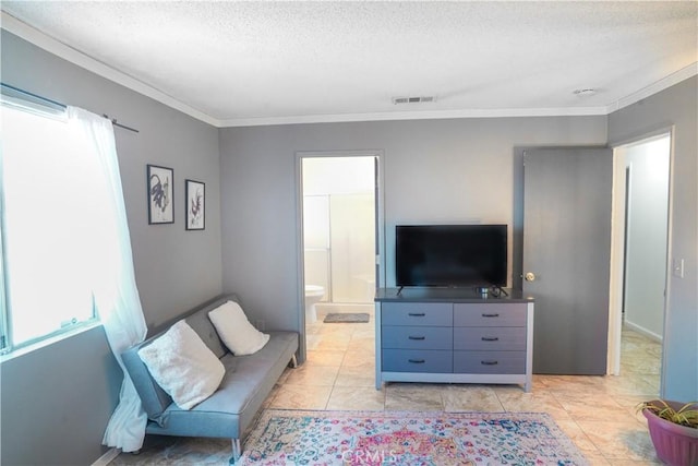 living room with a healthy amount of sunlight, ornamental molding, and a textured ceiling