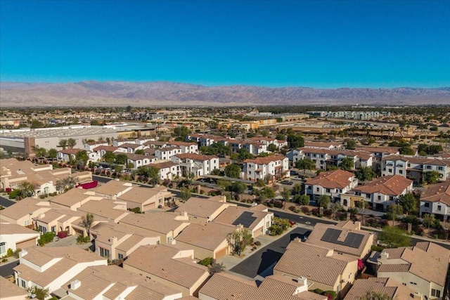 birds eye view of property featuring a mountain view