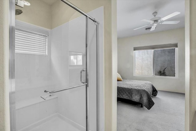 bedroom featuring carpet, ceiling fan, and multiple windows