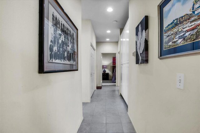 corridor with light tile patterned floors