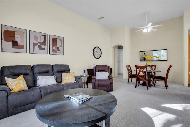 living room featuring ceiling fan and light carpet