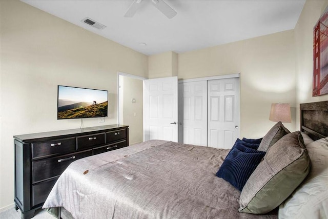 bedroom with ceiling fan and a closet