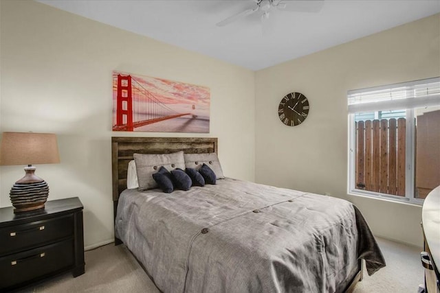 bedroom featuring ceiling fan and light carpet