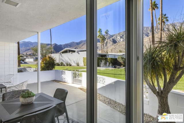 sunroom featuring a mountain view