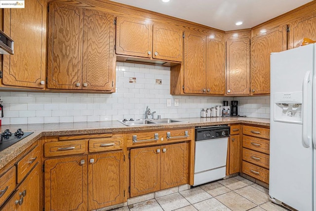 kitchen featuring decorative backsplash, white appliances, sink, and light tile patterned floors