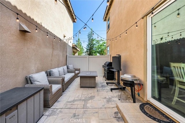 view of patio featuring an outdoor living space and a grill