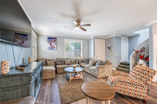 living room featuring hardwood / wood-style flooring, ceiling fan, and ornamental molding