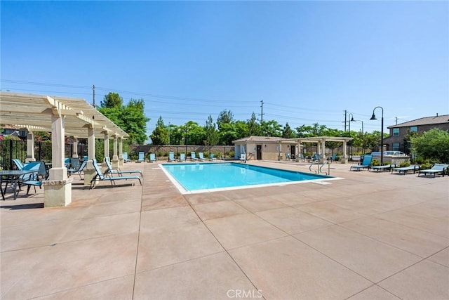 view of swimming pool featuring a pergola and a patio