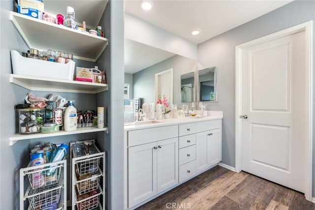 bathroom with vanity and hardwood / wood-style flooring