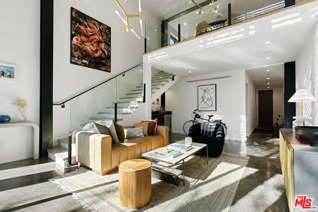 living room featuring a towering ceiling