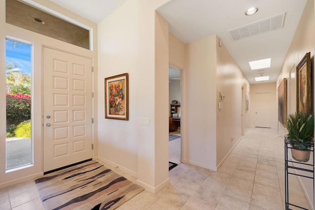 entrance foyer with light tile patterned floors