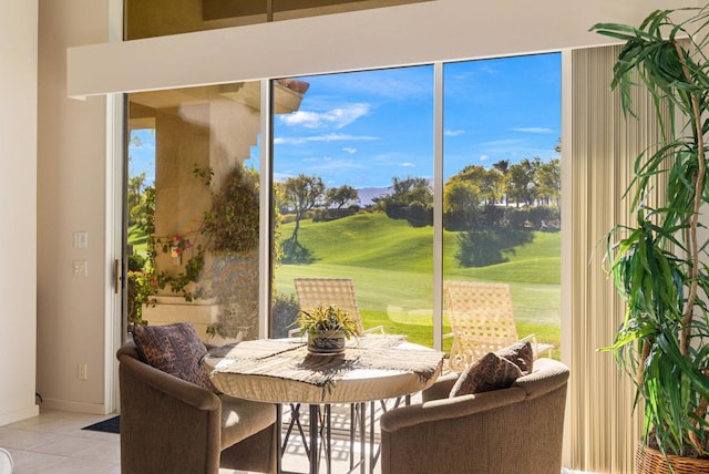 doorway to outside featuring a wealth of natural light and light tile patterned floors