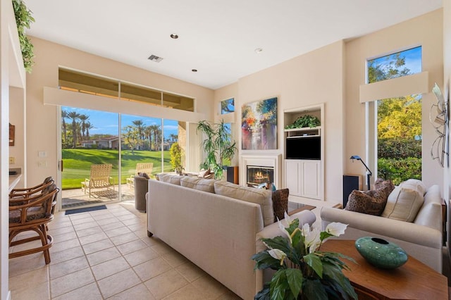 tiled living room featuring built in features