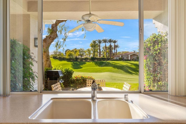 room details featuring ceiling fan and sink