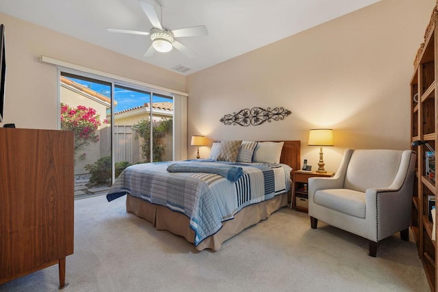 bedroom with access to outside, ceiling fan, and light colored carpet