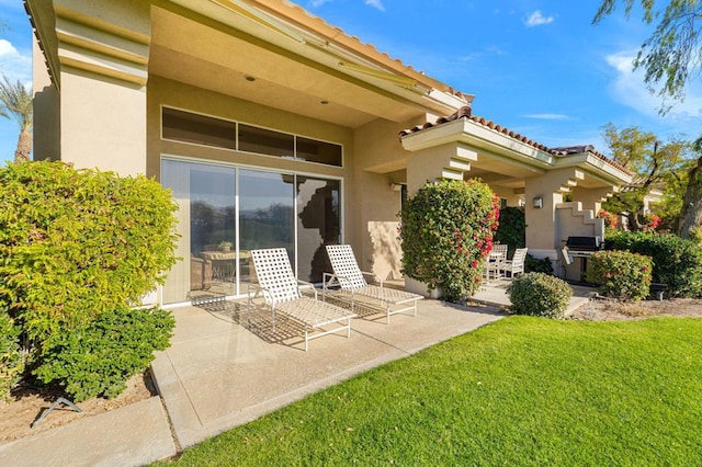 exterior space with a yard and a patio