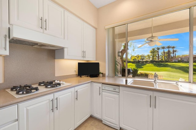 kitchen featuring white cabinets and white gas stovetop