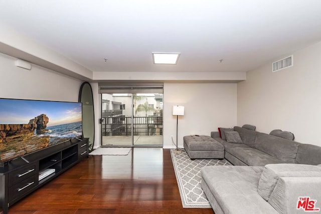 living room featuring dark hardwood / wood-style floors