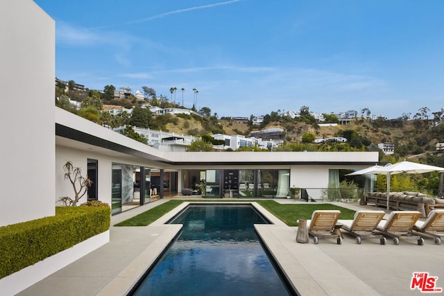 view of pool featuring a patio area