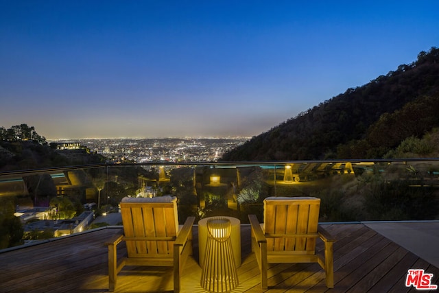 deck at dusk with a mountain view