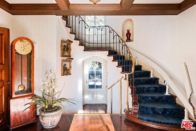 stairway featuring hardwood / wood-style floors and ornamental molding