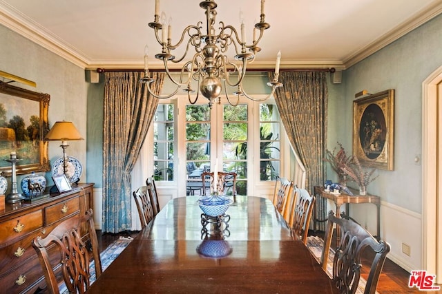 dining room featuring a chandelier, french doors, and ornamental molding