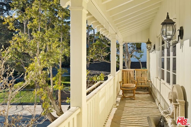 balcony featuring a porch