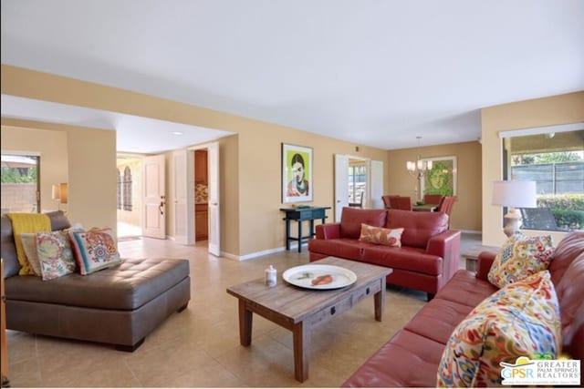 living room featuring a notable chandelier