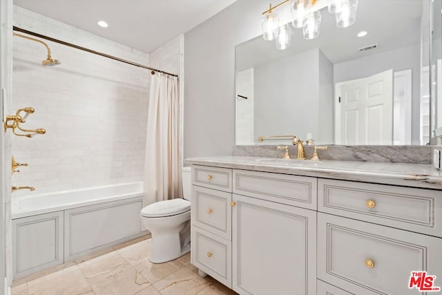 full bathroom featuring vanity, toilet, and shower / tub combo