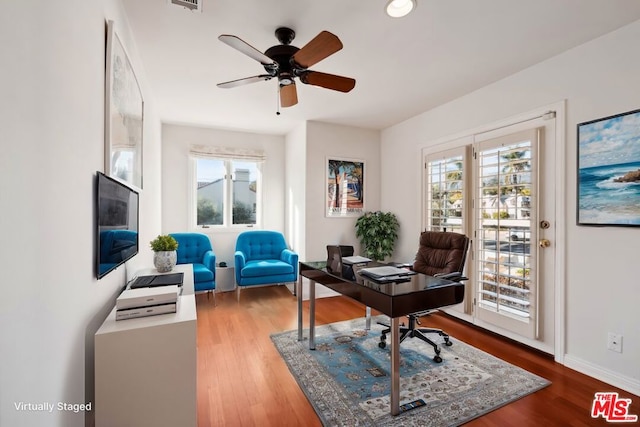 office space with hardwood / wood-style floors, a wealth of natural light, and ceiling fan