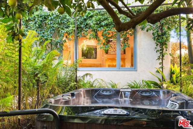 exterior details featuring a jacuzzi