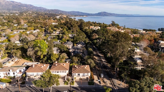 birds eye view of property featuring a water and mountain view