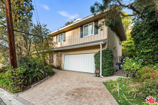 view of front of property featuring a garage