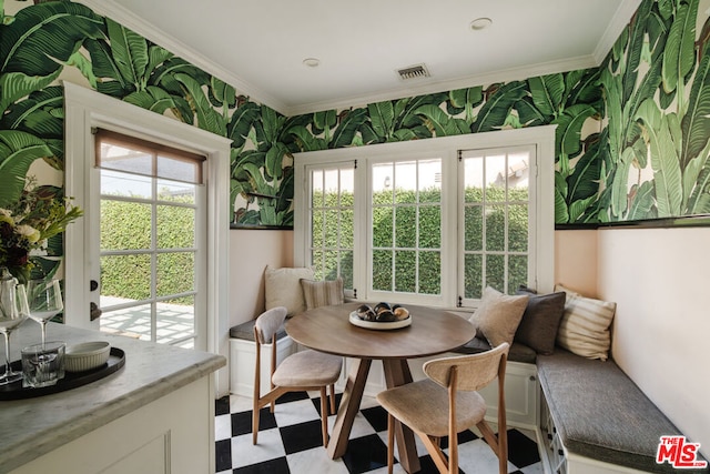 dining area featuring breakfast area and ornamental molding