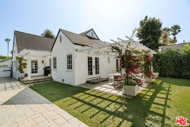 back of house with a lawn, a pergola, a patio, and french doors