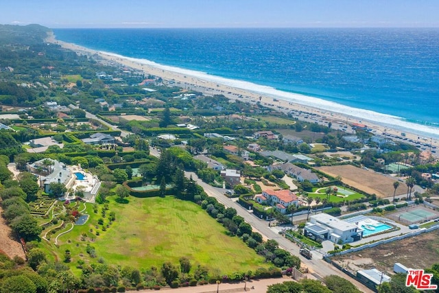 drone / aerial view featuring a view of the beach and a water view