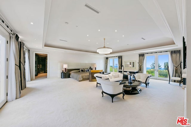 carpeted bedroom featuring a tray ceiling, french doors, ornamental molding, and access to outside