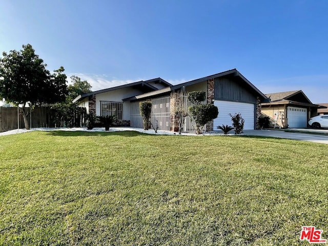 single story home with a garage and a front yard