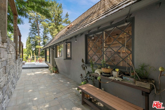 view of property exterior featuring a patio area