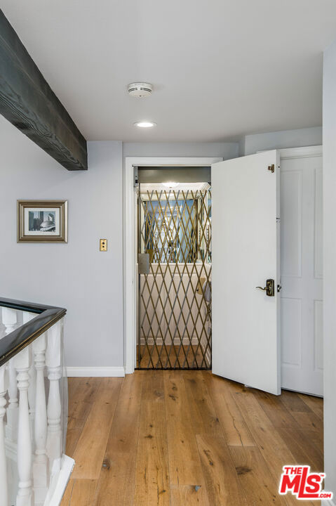 hallway featuring light wood-type flooring