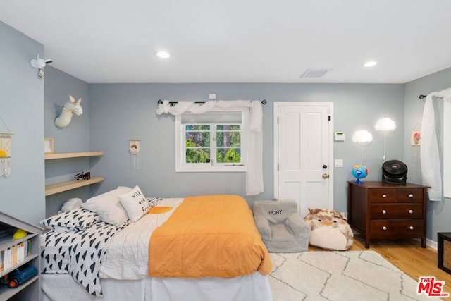 bedroom featuring light wood-type flooring