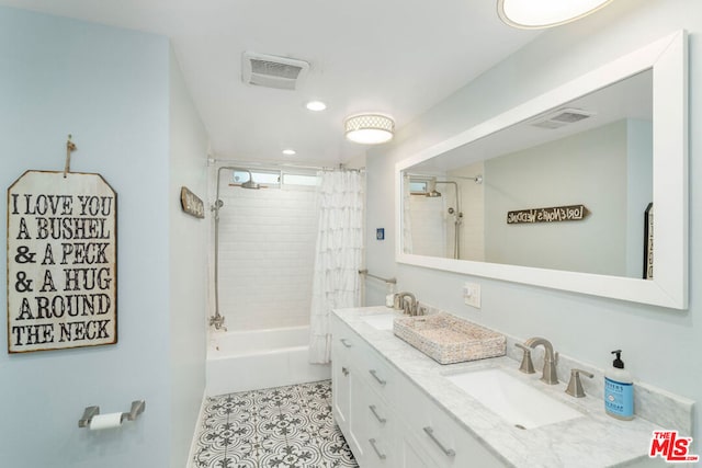 bathroom with tile patterned flooring, vanity, and shower / bathtub combination with curtain